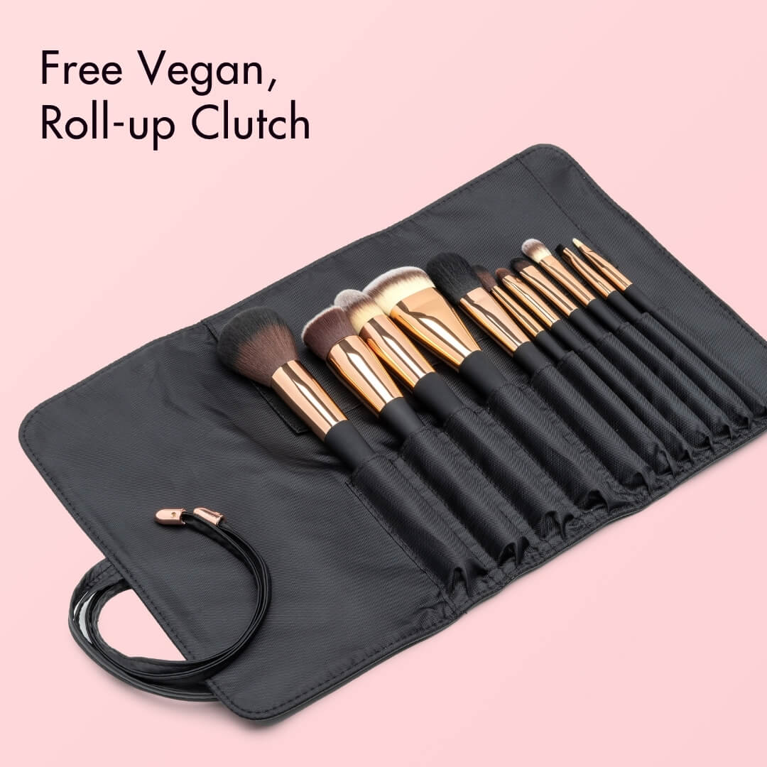 Aria Pro 12-piece professional makeup brush set with gold ferrules in a black vegan leather roll-up travel clutch.