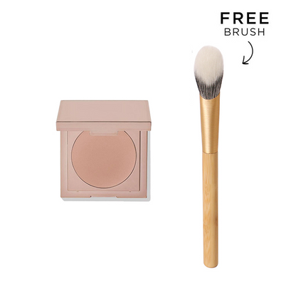 K-Beauty Colored Clay Undereye Corrector concealer in a rose gold compact next to a professional makeup brush.