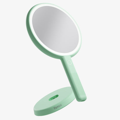 Cami green LED lighted handheld makeup mirror with 1x/5x magnification and vanity stand for skincare.