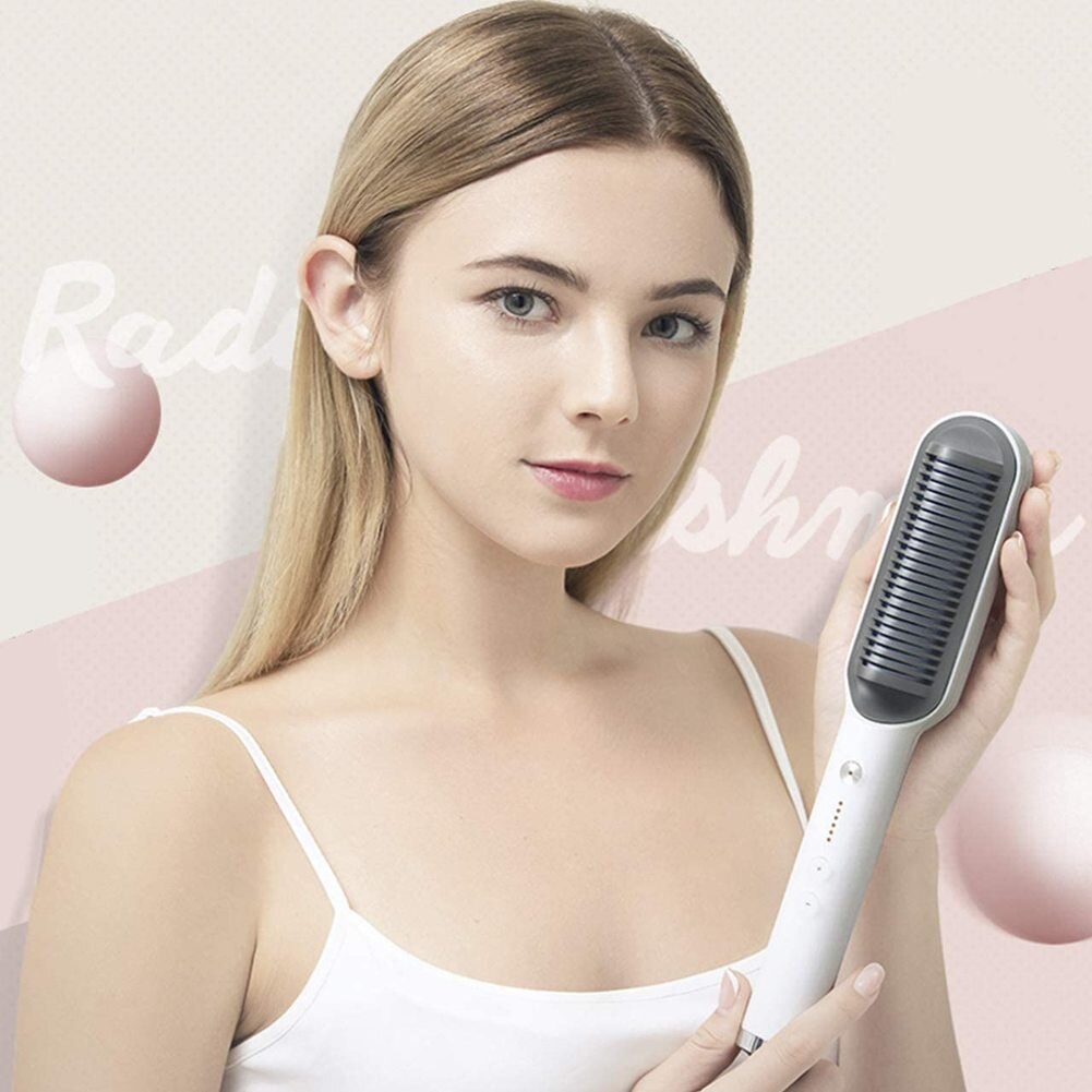 Woman with sleek hair holding a Revive Hair negative ion straightening comb with ceramic anti-scald design.