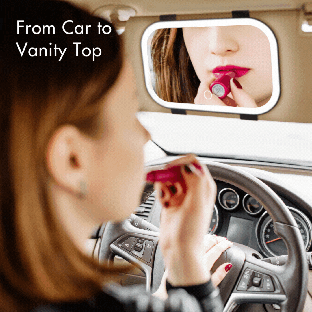 Juni 2 LED lighted car visor mirror with dimmable frame, showing a woman applying lipstick in a car vanity mirror.