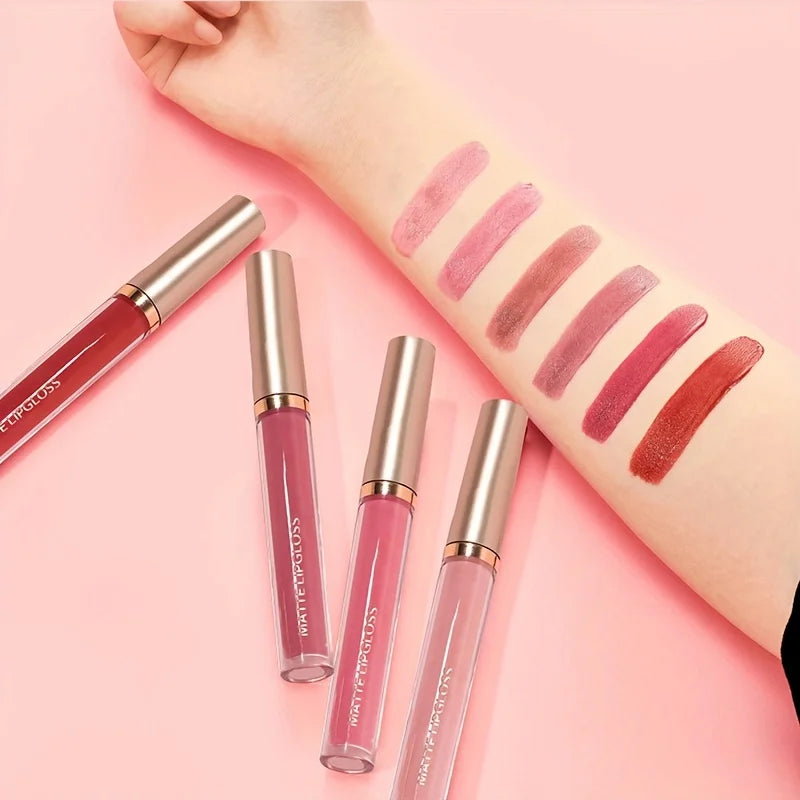 Six matte lip gloss swatches on arm ranging from nude to berry, with four gold-capped Luxe Glow lip gloss tubes.