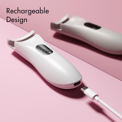 White Tasha rechargeable heated eyelash curler with USB charging cable on a pink background.