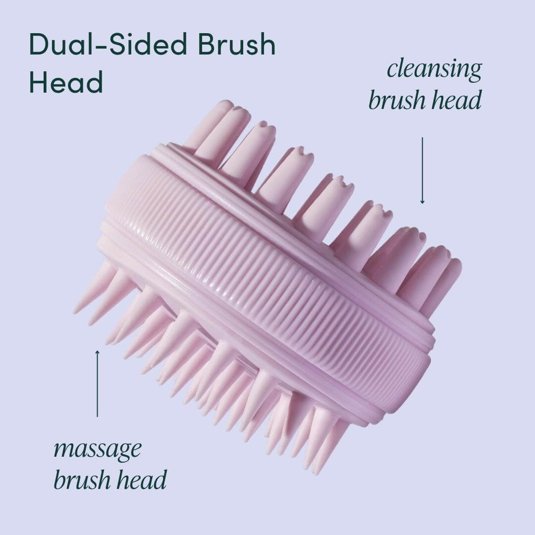 Pink Charlotte dual-sided silicone scalp massager featuring a cleansing brush head and a massage brush head.