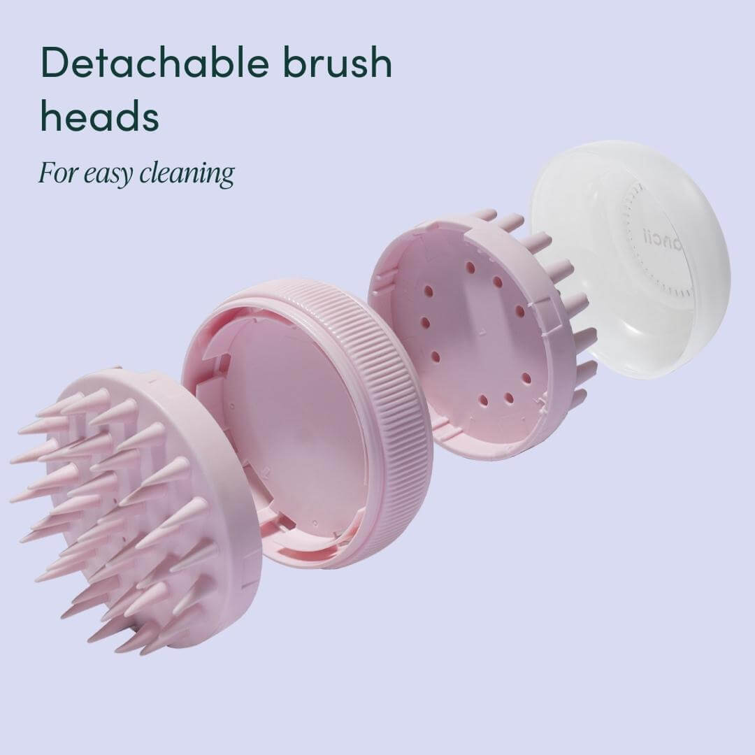Charlotte pink silicone scalp massager with detachable brush heads for easy cleaning and exfoliation.