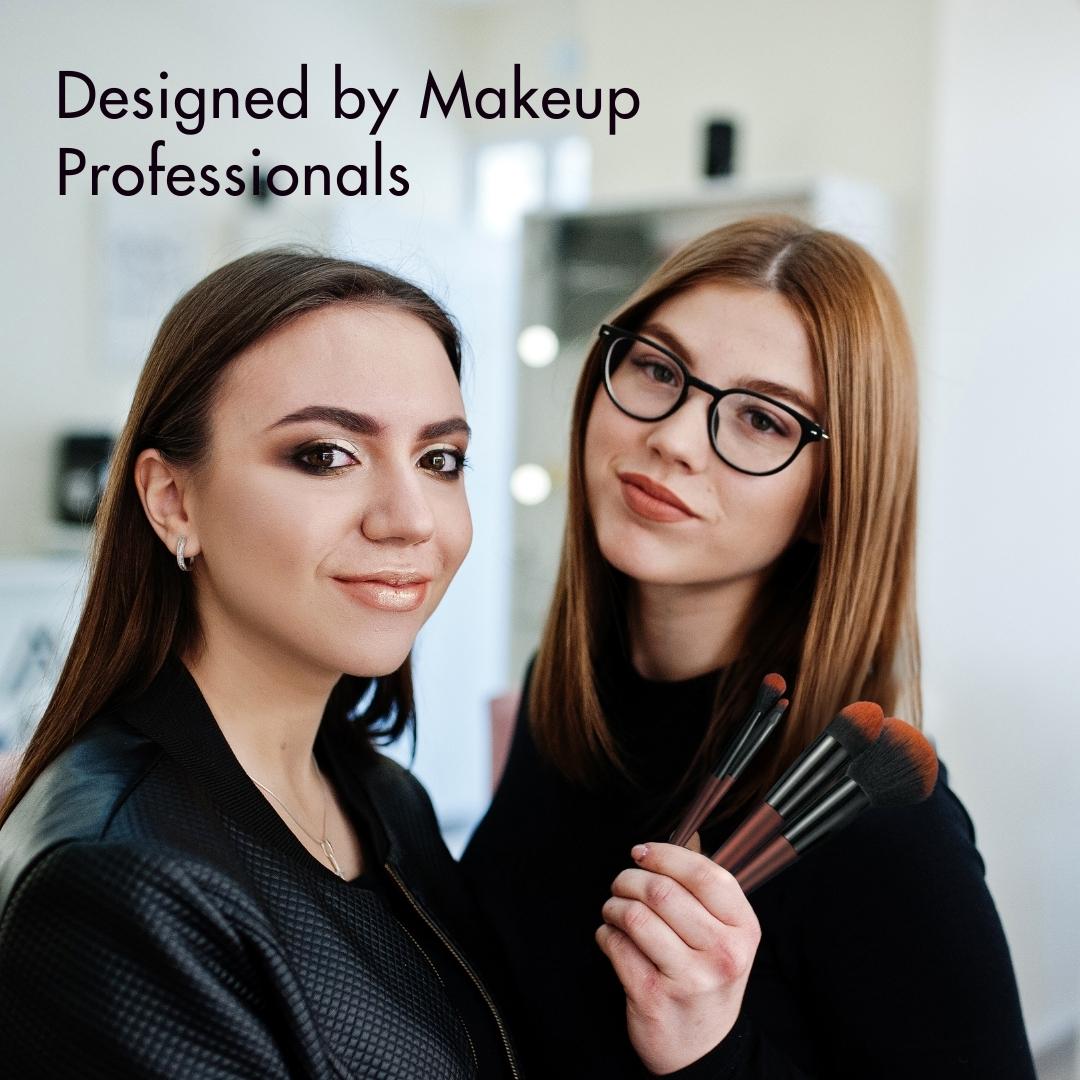 Two professional makeup artists holding Aria Pro 12-piece brushes, showcasing fluffy bristles and professional-grade tools.